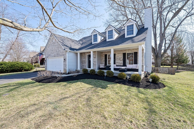 new england style home featuring driveway, a front lawn, a porch, fence, and an outdoor hangout area