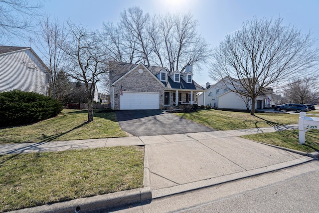 view of front of home with a front lawn, fence, aphalt driveway, stone siding, and an attached garage