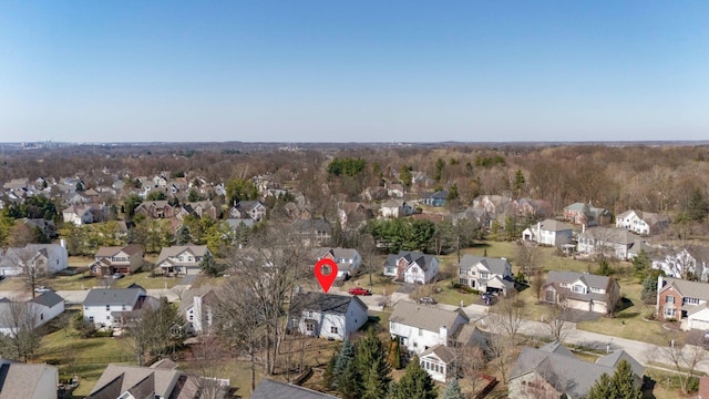 birds eye view of property with a residential view