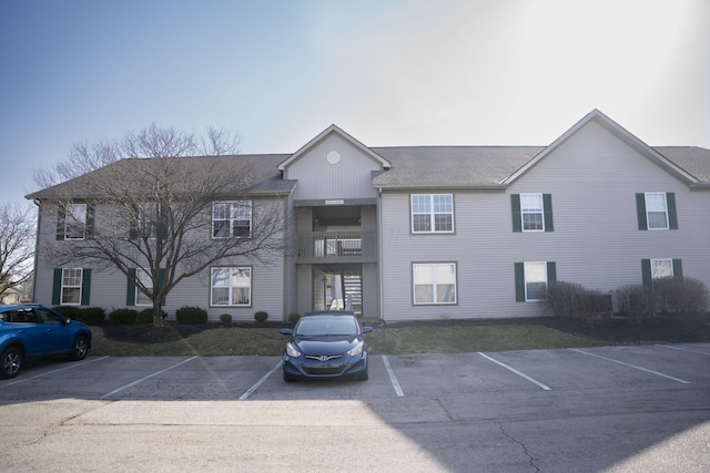 view of property featuring uncovered parking