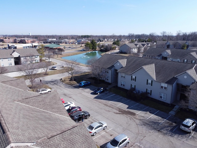 birds eye view of property featuring a residential view and a water view