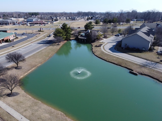 drone / aerial view featuring a residential view and a water view