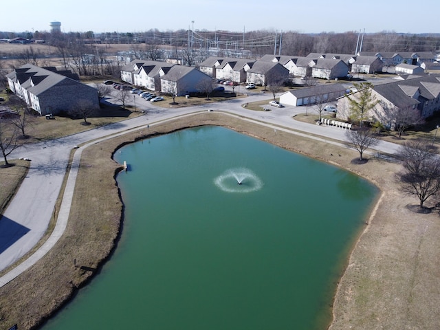 bird's eye view with a residential view and a water view