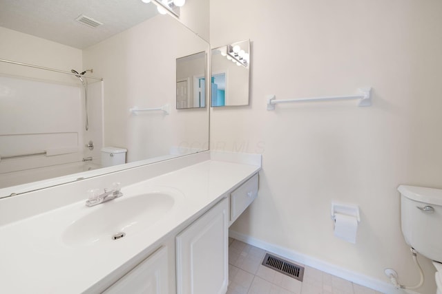 full bath with visible vents, toilet, vanity, and baseboards