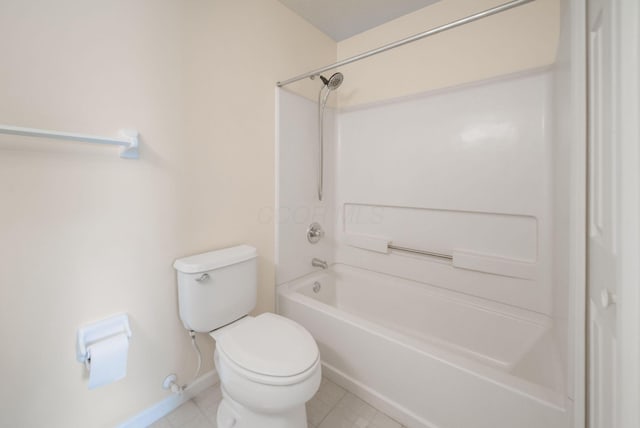 full bath with tile patterned floors, toilet, baseboards, and shower / washtub combination