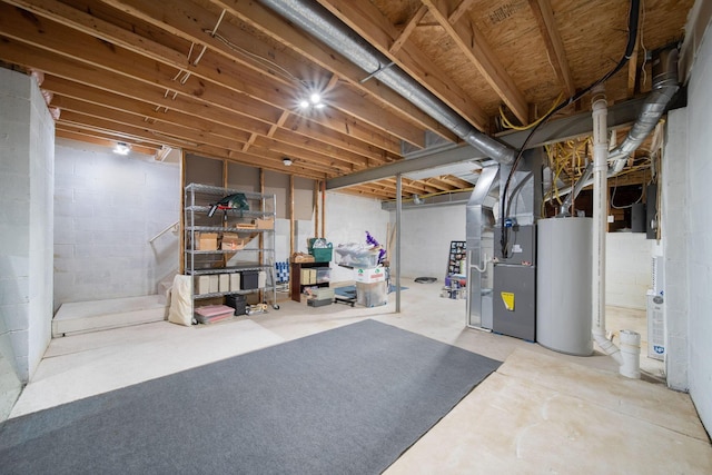 unfinished basement with heating unit and water heater