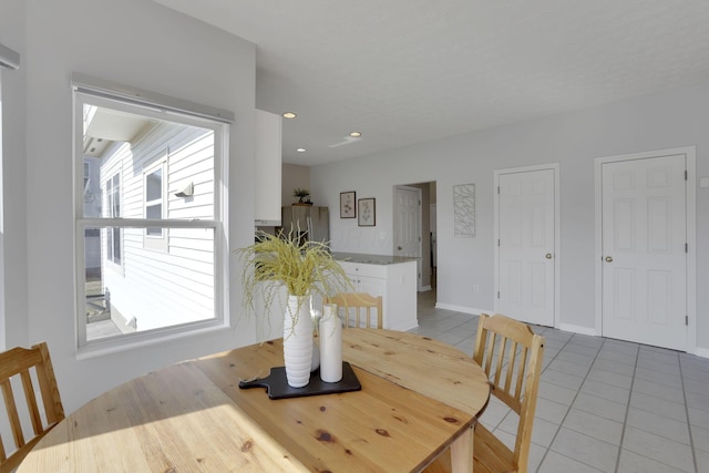 dining area featuring light tile patterned floors, baseboards, and recessed lighting