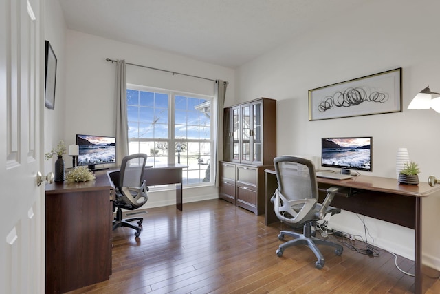 office space featuring wood finished floors and baseboards