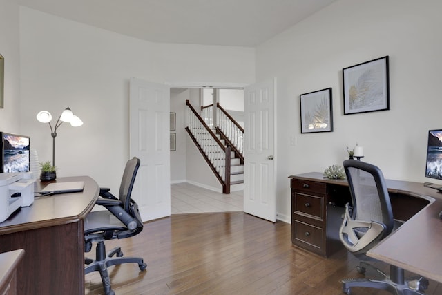 home office with wood finished floors