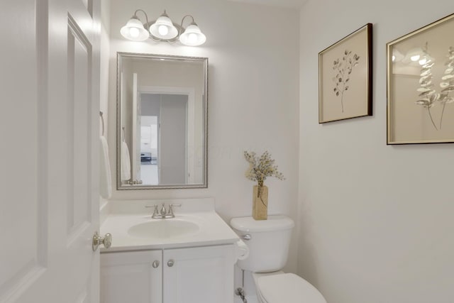 bathroom with toilet and vanity