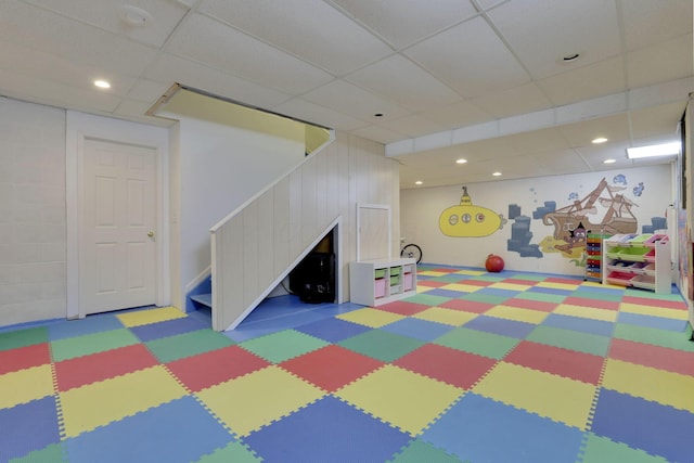 rec room with recessed lighting and a paneled ceiling