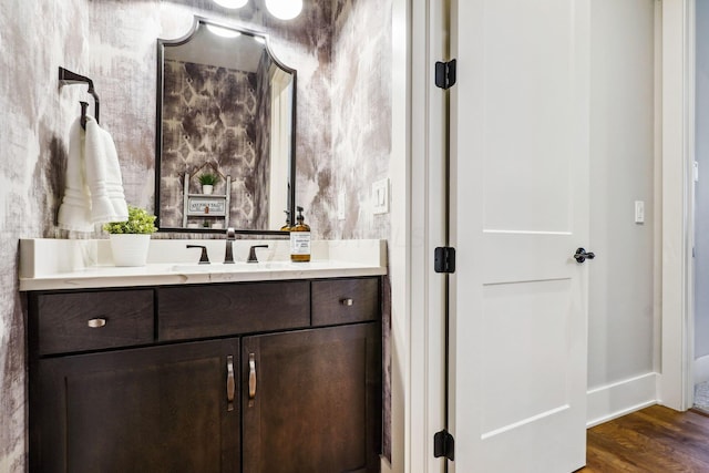 bathroom featuring vanity and wood finished floors