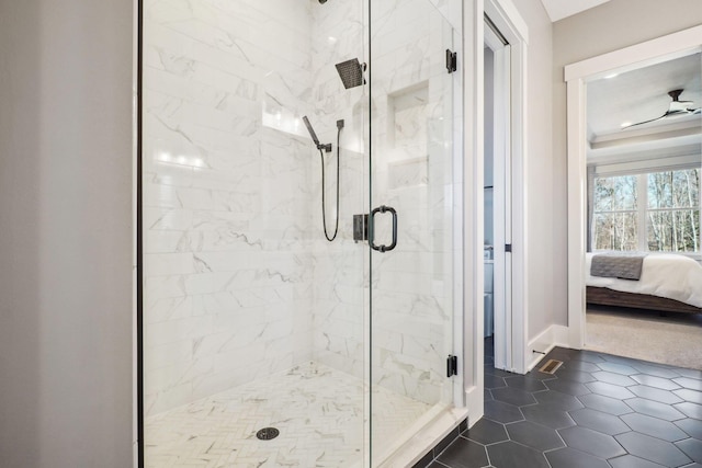 full bath featuring a marble finish shower, tile patterned floors, ensuite bath, and baseboards