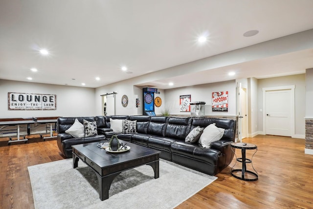 living area with recessed lighting, baseboards, and light wood finished floors