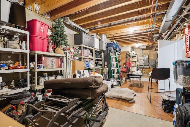 unfinished basement featuring electric panel