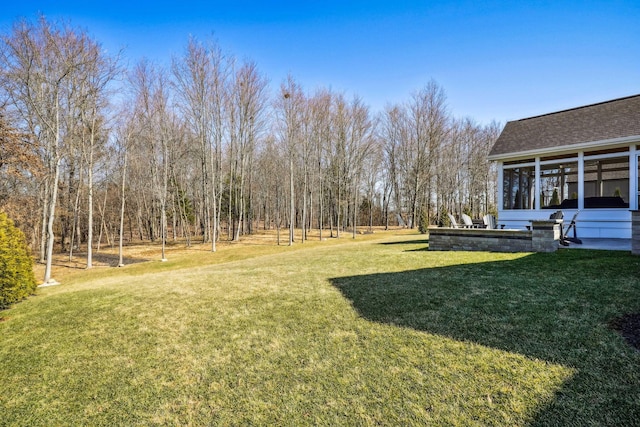 view of yard with a sunroom