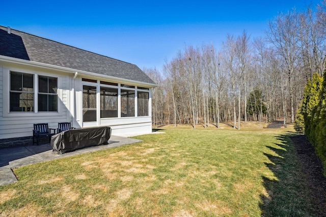 view of yard with a patio area and a sunroom