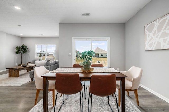 dining space featuring recessed lighting, visible vents, baseboards, and dark wood finished floors