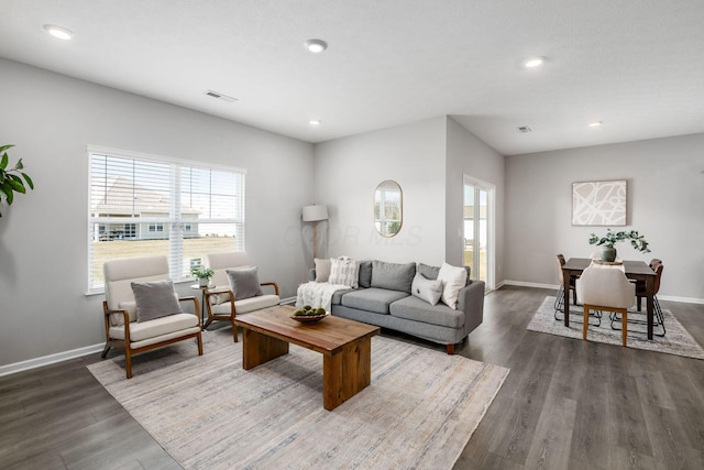 living area with visible vents, recessed lighting, baseboards, and dark wood-style flooring