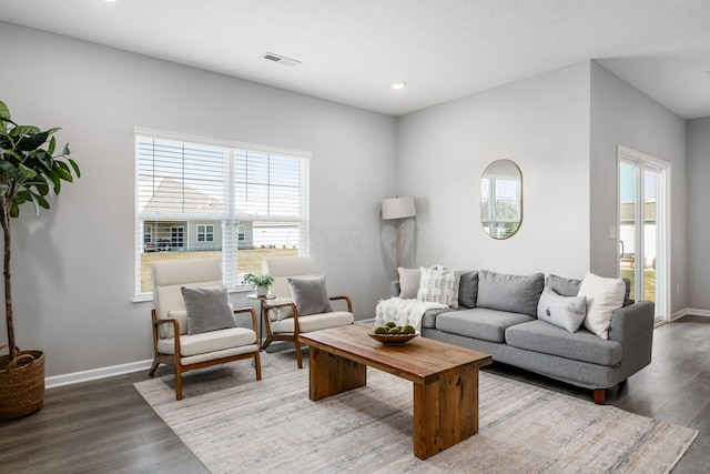 living area featuring visible vents, recessed lighting, wood finished floors, and baseboards