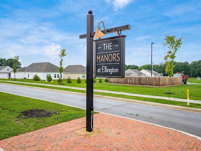 view of road featuring a residential view, curbs, and sidewalks