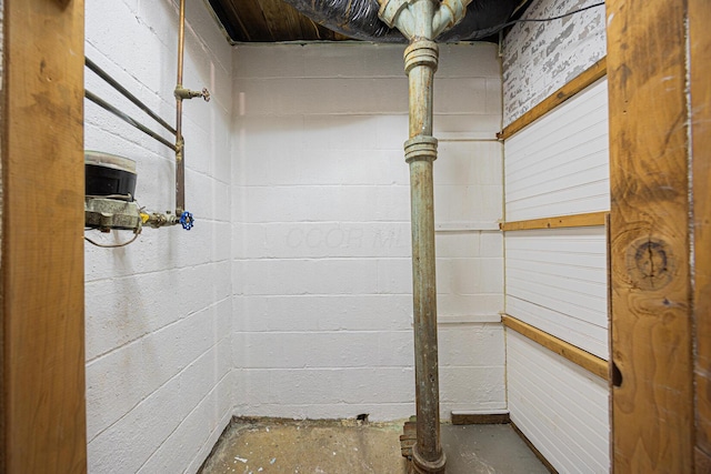 interior space with concrete block wall