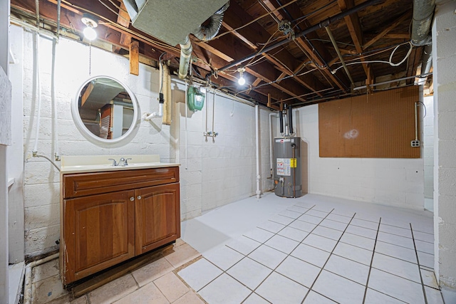 unfinished below grade area with water heater and a sink