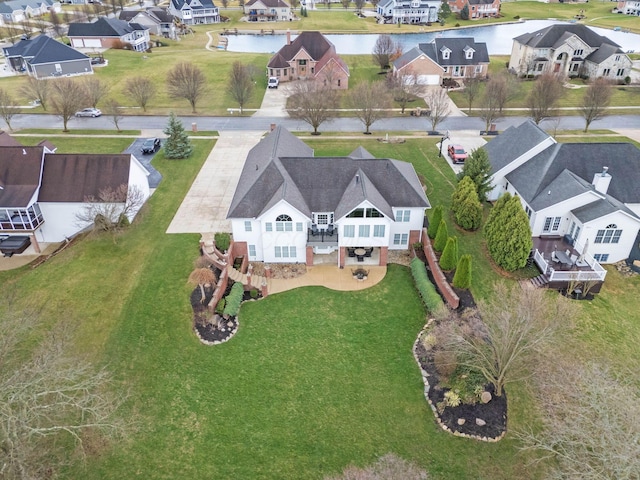 aerial view with a residential view and a water view