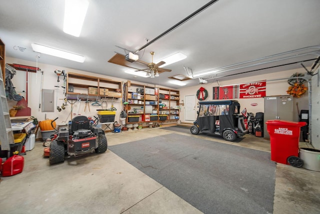 garage with electric panel and a garage door opener