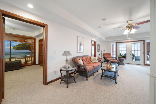 living room with light carpet, recessed lighting, french doors, baseboards, and ceiling fan