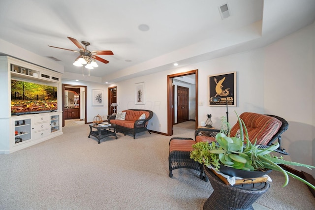 carpeted living room with recessed lighting, visible vents, baseboards, and a ceiling fan