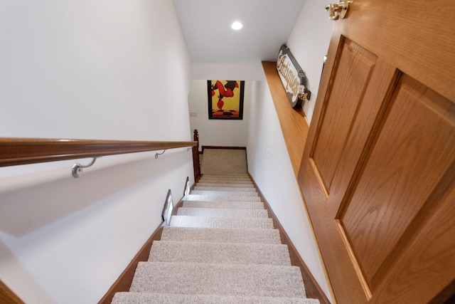 staircase featuring recessed lighting, baseboards, and carpet flooring
