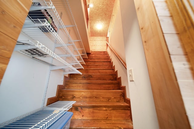 stairs with wood finished floors