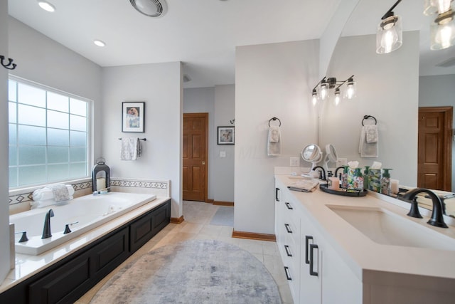 full bathroom featuring tile patterned floors, a garden tub, a sink, double vanity, and baseboards