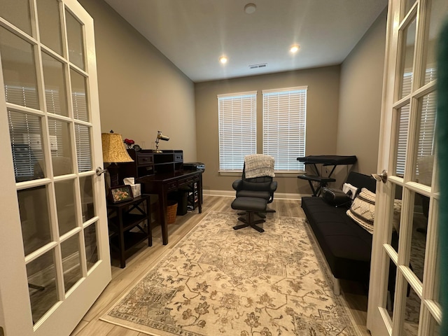 home office with visible vents, french doors, baseboards, and wood finished floors