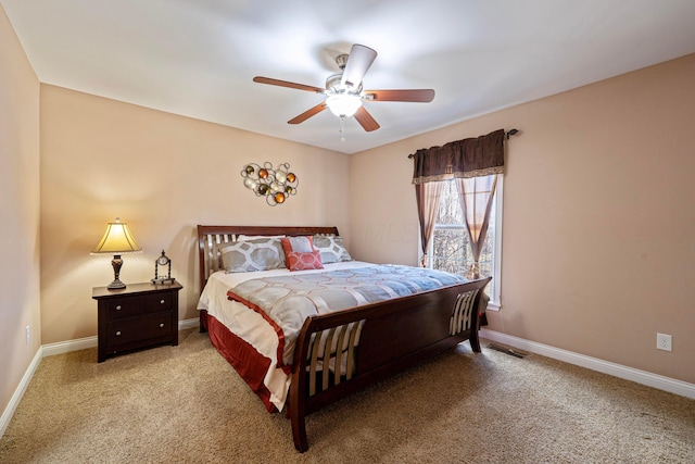 carpeted bedroom featuring visible vents, ceiling fan, and baseboards