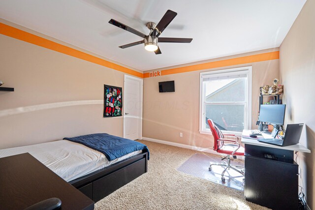 bedroom featuring baseboards, carpet floors, and ceiling fan