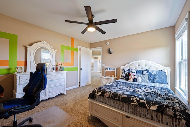 bedroom featuring light colored carpet and ceiling fan