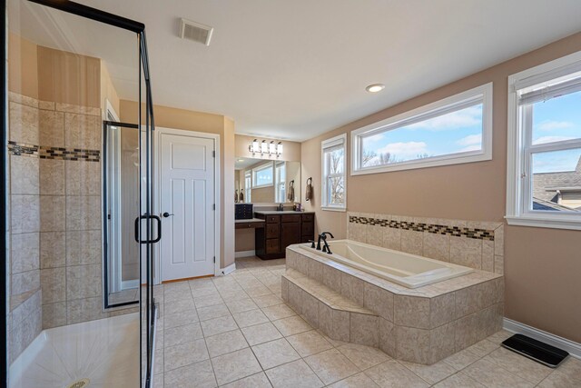 bathroom featuring visible vents, a garden tub, a stall shower, tile patterned floors, and vanity