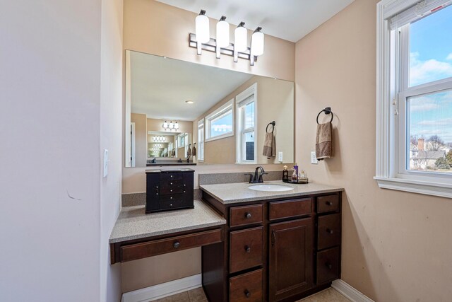 bathroom featuring vanity and baseboards