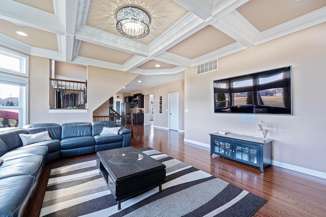 living area featuring visible vents, beam ceiling, coffered ceiling, and baseboards