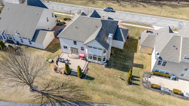 birds eye view of property with a residential view