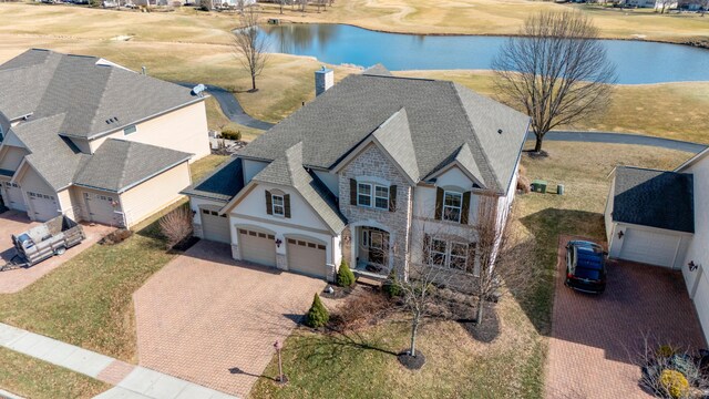 birds eye view of property featuring a water view