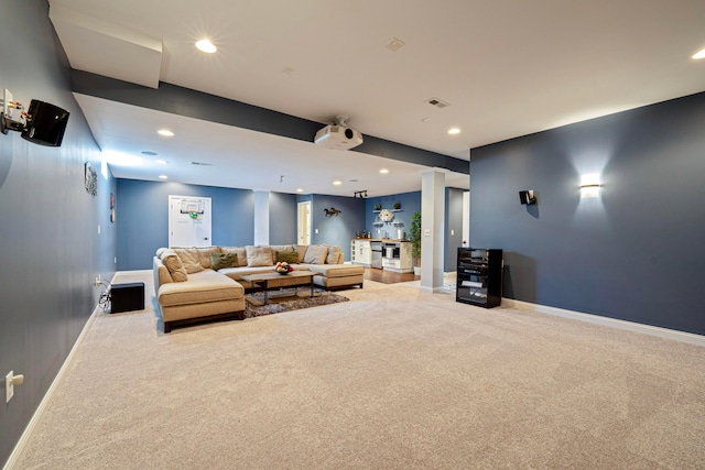 living area featuring recessed lighting, baseboards, visible vents, and carpet floors