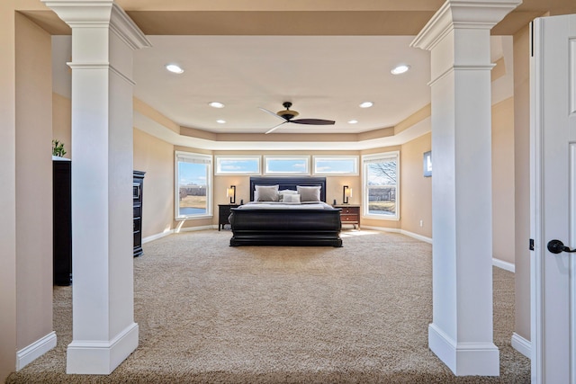 carpeted bedroom with recessed lighting, baseboards, and ornate columns