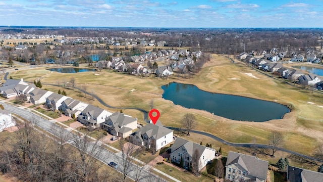 drone / aerial view with a residential view and a water view