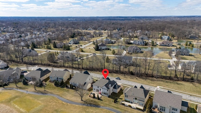 bird's eye view with a residential view and a water view