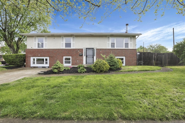 raised ranch with brick siding and stucco siding