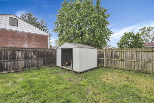 view of yard featuring a shed and an outbuilding