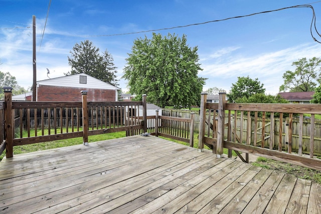 wooden terrace featuring a fenced backyard
